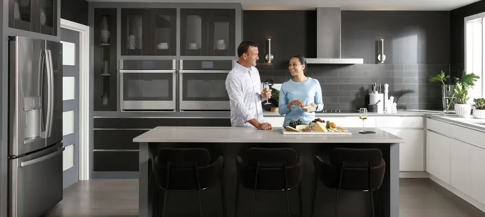 two people in kitchen